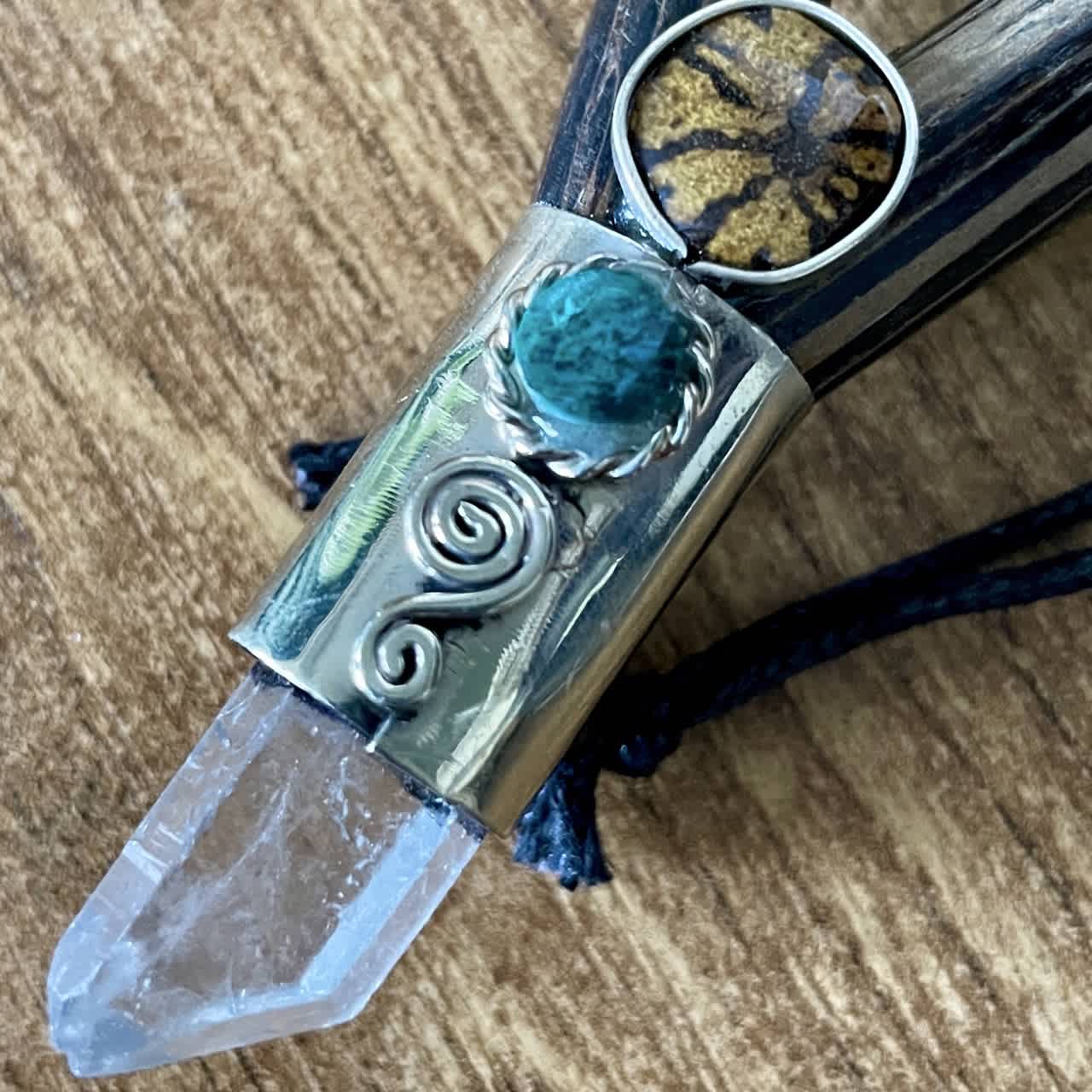 Detail of the Aya vine slice, turquoise and rock crystal point on the Kuripe